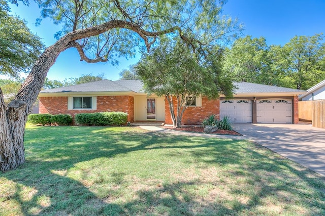 ranch-style house with a garage and a front lawn