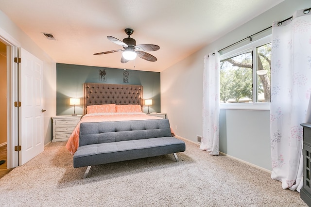 carpeted bedroom with ceiling fan