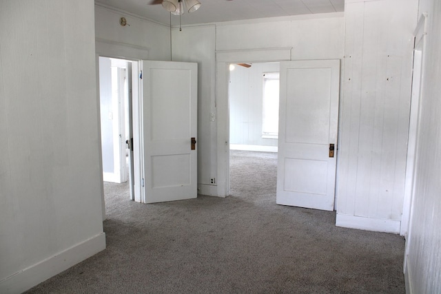 1002 Broadway St, Ballinger, TX 76821 - unfurnished room featuring ceiling fan and carpet flooring