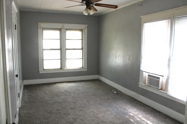 1002 Broadway St, Ballinger, TX 76821 - empty room with a ceiling fan, healthy amount of natural light, carpet, cooling unit, and crown molding