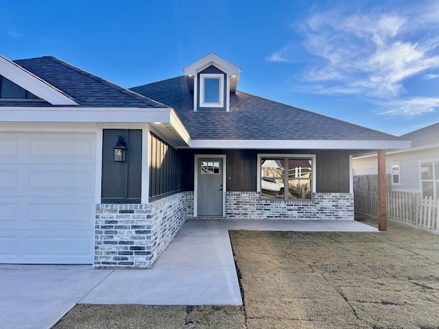 view of exterior entry with a garage