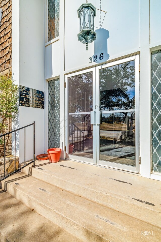 property entrance featuring a patio