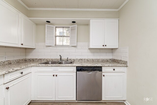 kitchen featuring white cabinetry, sink, tasteful backsplash, and stainless steel dishwasher