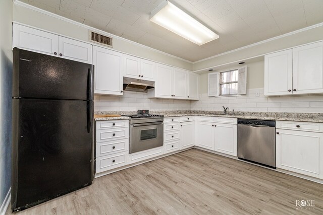 kitchen featuring sink, stainless steel appliances, light stone counters, ornamental molding, and white cabinets