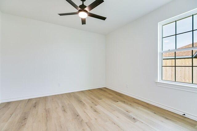 unfurnished room featuring ceiling fan and light hardwood / wood-style flooring