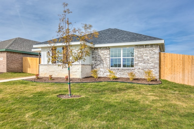 view of front of house with a front lawn