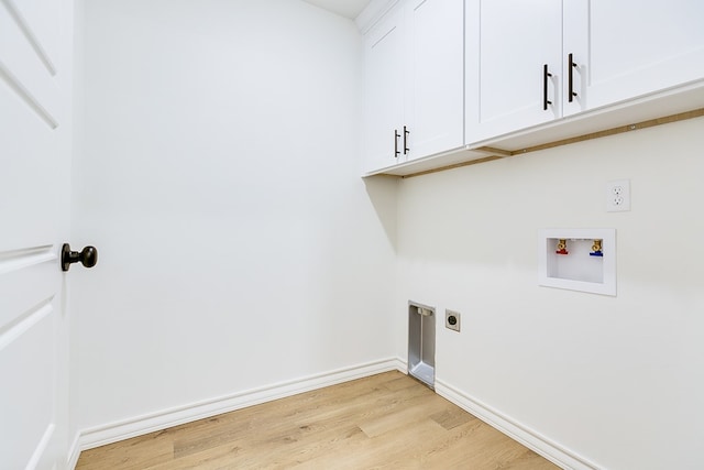 clothes washing area with cabinets, washer hookup, hookup for an electric dryer, and light hardwood / wood-style flooring