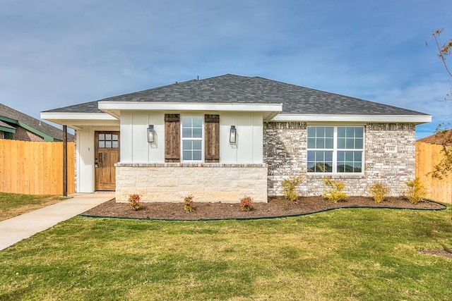 ranch-style home with a front lawn