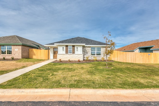 ranch-style home with a front yard