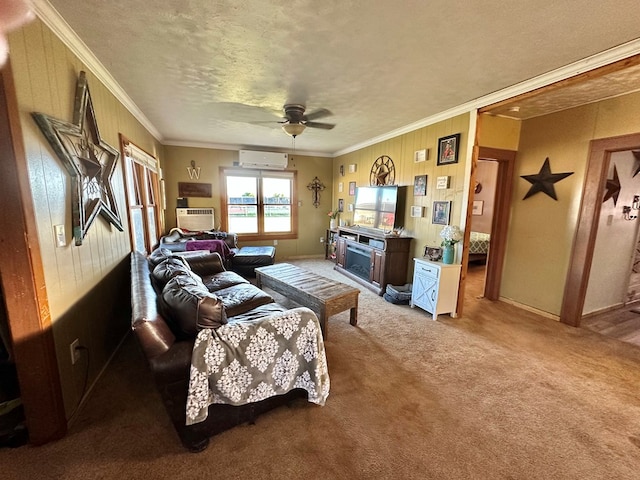 1501 Bishop St, Robert Lee, TX 76945 - carpeted living room with an AC wall unit, a ceiling fan, crown molding, wooden walls, and a textured ceiling