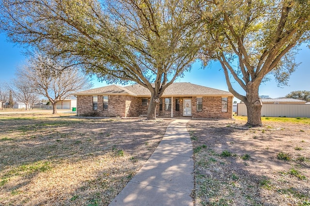 single story home with brick siding