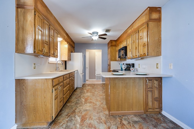 kitchen with electric stove, a sink, black microwave, light countertops, and ceiling fan