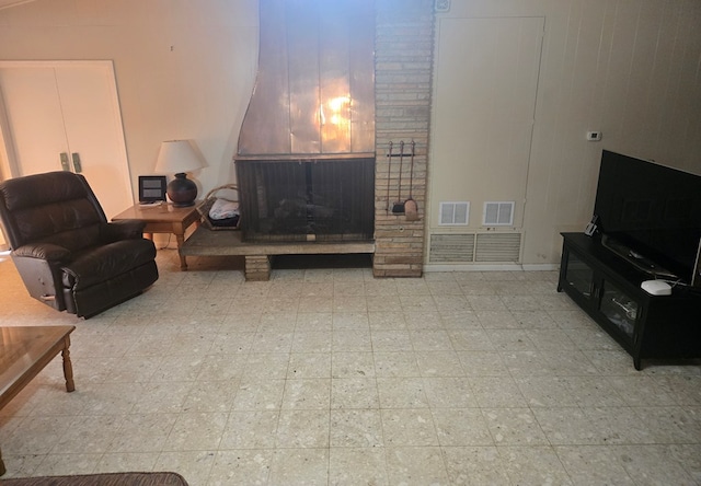 living room featuring visible vents and light floors