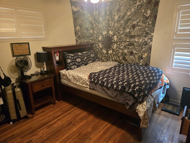 bedroom with wood finished floors