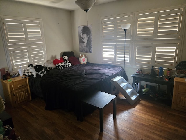 bedroom with wood finished floors