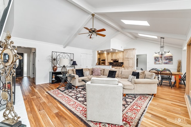 3110 Palo Duro Dr, San Angelo, TX 76904 - living area with beam ceiling, a ceiling fan, light wood finished floors, high vaulted ceiling, and a skylight