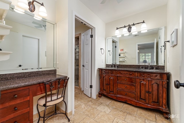 3110 Palo Duro Dr, San Angelo, TX 76904 - bathroom featuring stone tile floors, double vanity, and a ceiling fan
