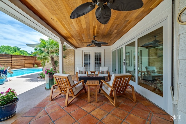 3110 Palo Duro Dr, San Angelo, TX 76904 - fenced backyard featuring ceiling fan, a patio area, and outdoor dining space