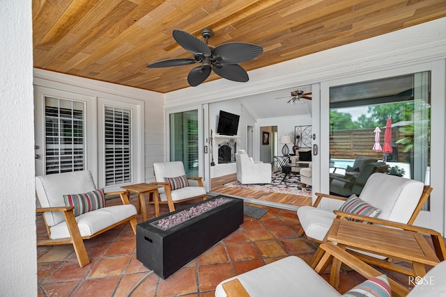 3110 Palo Duro Dr, San Angelo, TX 76904 - view of patio with a ceiling fan and an outdoor living space with a fire pit