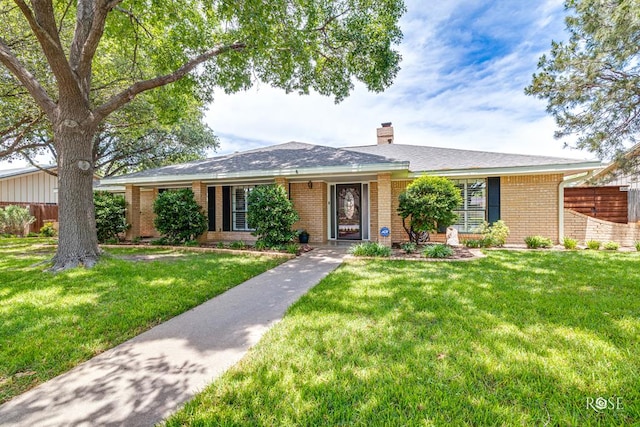 3110 Palo Duro Dr, San Angelo, TX 76904 - single story home with brick siding and a chimney