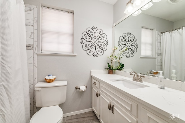 3110 Palo Duro Dr, San Angelo, TX 76904 - bathroom with vanity, wood finished floors, and a shower with shower curtain