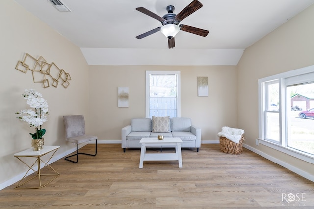 34 W 9th St, San Angelo, TX 76903 - living area with vaulted ceiling, plenty of natural light, baseboards, light wood-type flooring, and ceiling fan