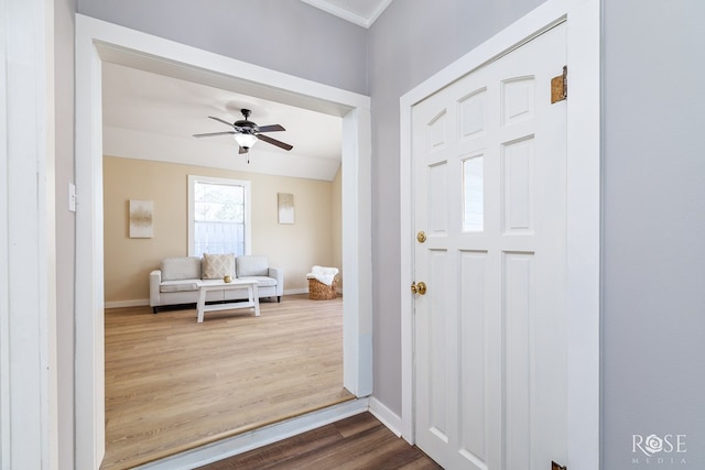 34 W 9th St, San Angelo, TX 76903 - foyer featuring dark wood-style floors, a ceiling fan, and baseboards