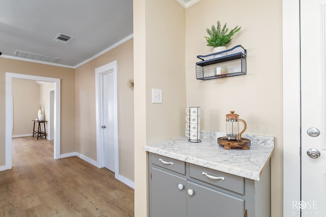 34 W 9th St, San Angelo, TX 76903 - corridor featuring crown molding, light wood-style flooring, and baseboards