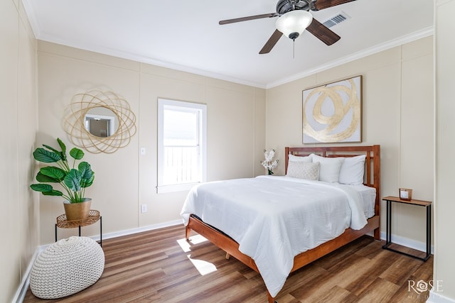 34 W 9th St, San Angelo, TX 76903 - bedroom featuring wood finished floors, crown molding, baseboards, and ceiling fan