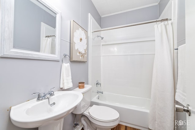 34 W 9th St, San Angelo, TX 76903 - bathroom featuring a sink, toilet, and shower / bath combination with curtain