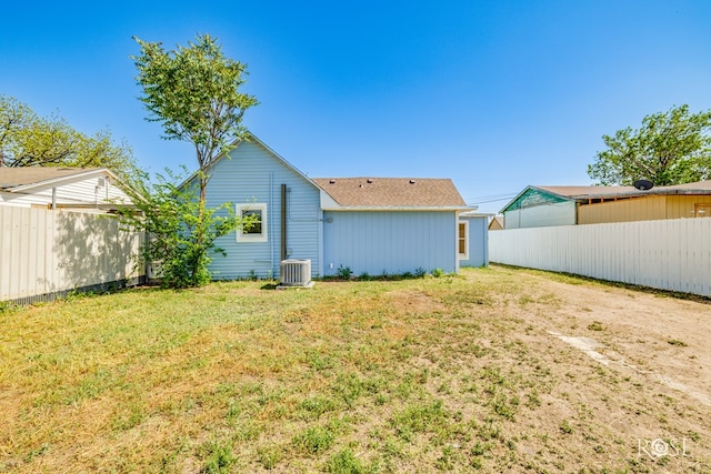 34 W 9th St, San Angelo, TX 76903 - rear view of property featuring central AC unit