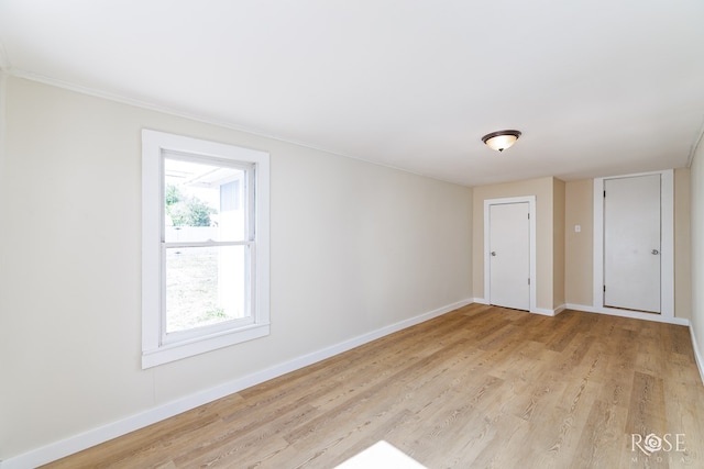 34 W 9th St, San Angelo, TX 76903 - spare room featuring baseboards and light wood-style floors