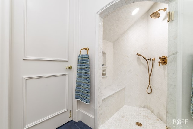 bathroom featuring tiled shower