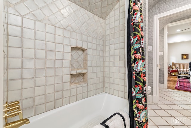 bathroom featuring tile patterned floors, toilet, and shower / tub combo with curtain