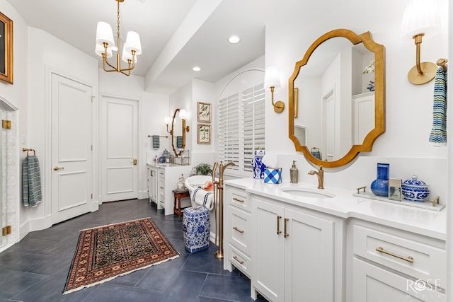 full bathroom with two vanities, recessed lighting, a sink, tile patterned flooring, and a chandelier