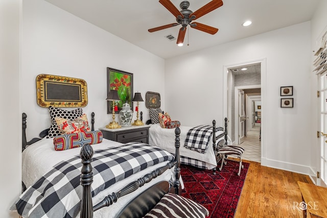 bedroom with visible vents, baseboards, recessed lighting, wood finished floors, and a ceiling fan