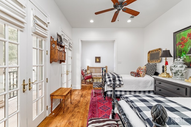 bedroom featuring visible vents, recessed lighting, french doors, and wood finished floors