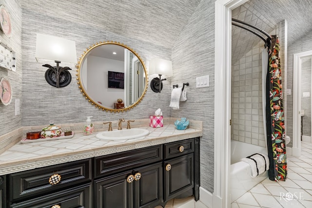 bathroom with tile patterned floors, shower / tub combo, vanity, and vaulted ceiling