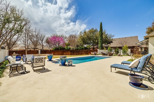 view of pool featuring a fenced backyard, a fenced in pool, and a patio