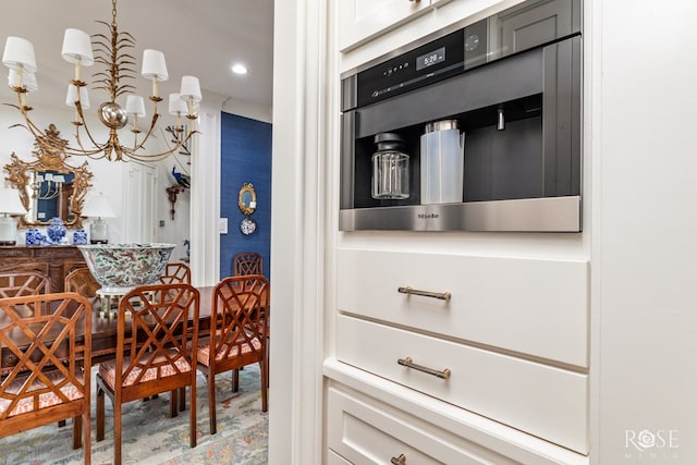 dining area featuring recessed lighting and an inviting chandelier