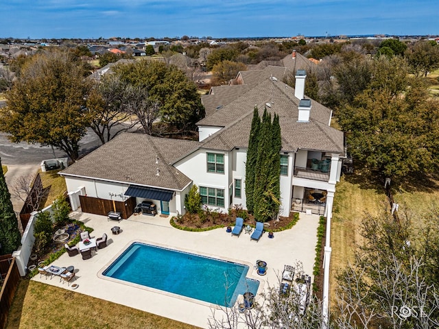 view of swimming pool with a fenced backyard, a fenced in pool, and a patio