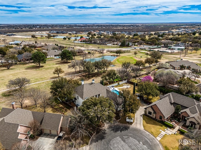 birds eye view of property featuring a residential view and a water view