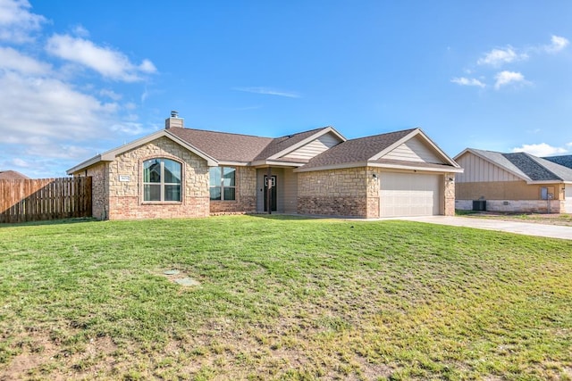 ranch-style house featuring a garage and a front yard