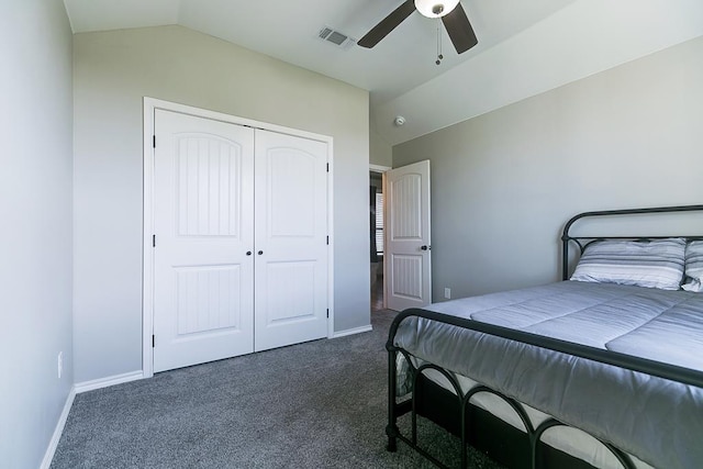 carpeted bedroom featuring lofted ceiling, ceiling fan, and a closet