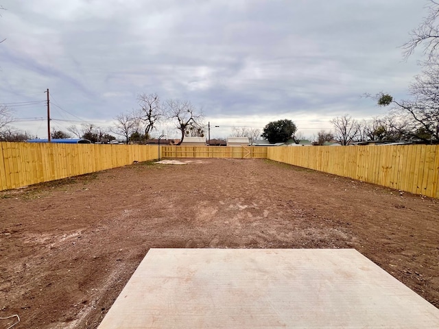 view of yard featuring a patio and a fenced backyard