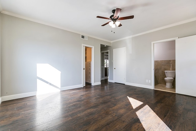 unfurnished bedroom featuring ceiling fan, ensuite bath, dark hardwood / wood-style flooring, and crown molding