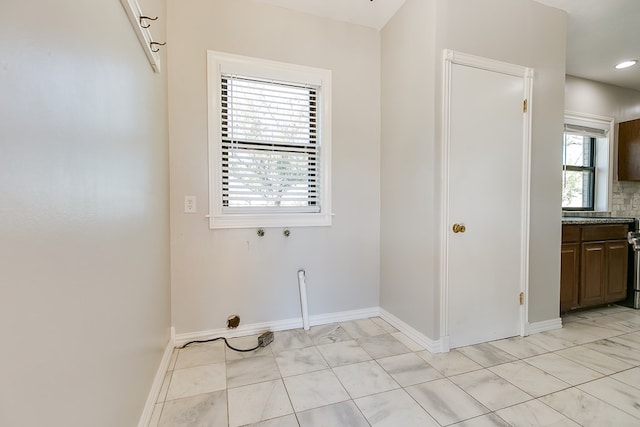 laundry area with washer hookup and a healthy amount of sunlight