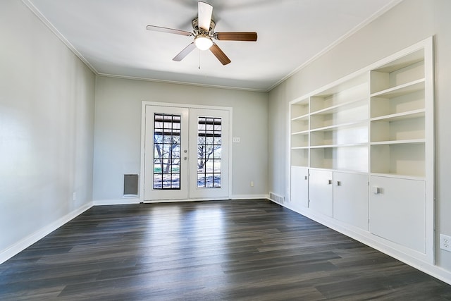 spare room featuring french doors, ceiling fan, dark wood-type flooring, and built in shelves