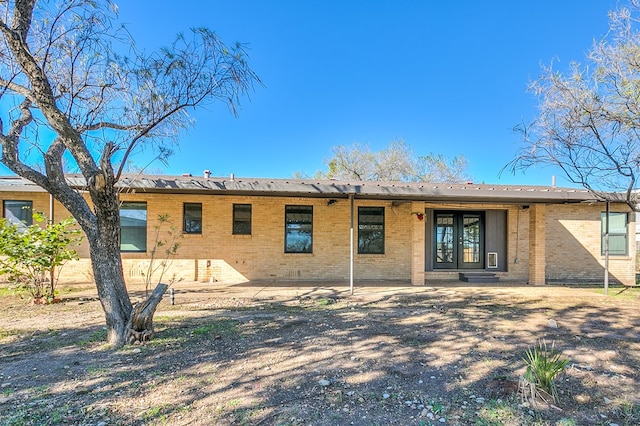 back of house with a patio