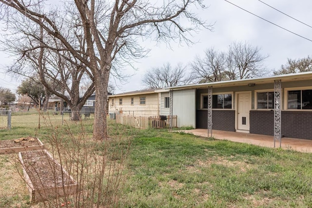 rear view of property with fence